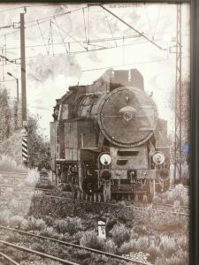 Hiperrealistyczny rysunek długopisem przedstawiający lokomotywę parową widzianą od przodu